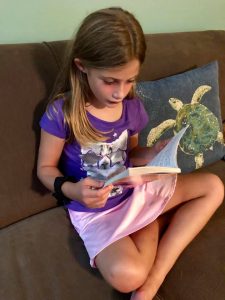 Girl reading chapter book